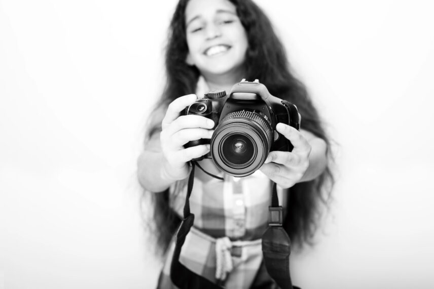 girl holding camera